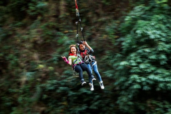 Nepal tandem bridge swing